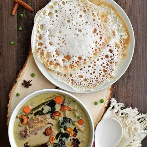 The classic Kerala breakfast: Fluffy Appams and rich coconut milk stew. Source: Pepper Delight