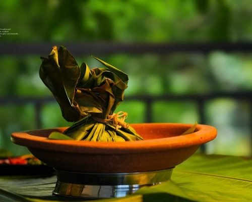 Authentic Kerala-style chemmeen kizhi at Spice Aromas Restaurant